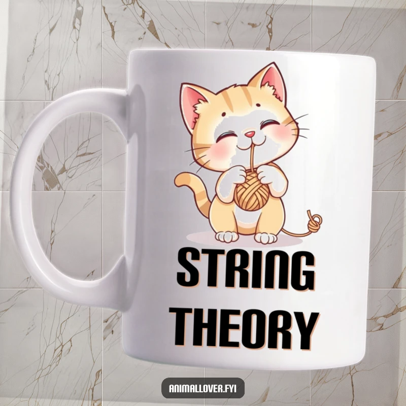 Funny mug showing a curious cat playfully batting at a dangling ball of yarn, full of feline mischief.