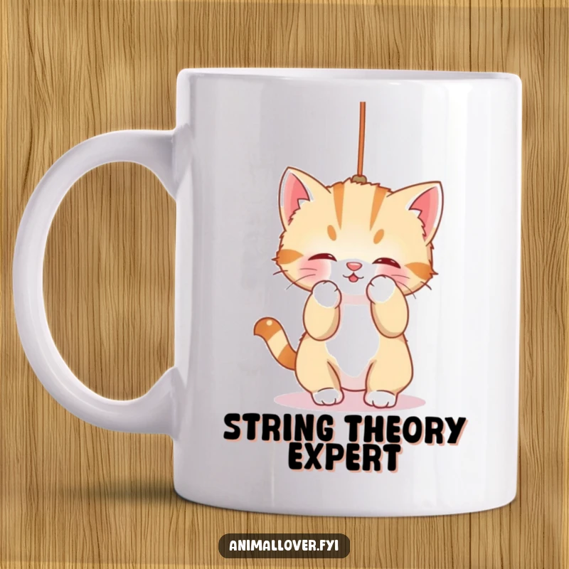 Funny Mug: A sweet kitten is playfully engrossed in batting at a dangling string, showcasing adorable feline antics.