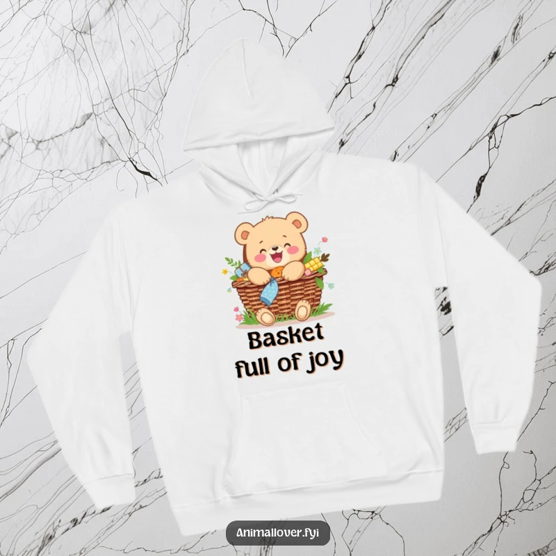 Funny hoodie featuring a joyful bear cub hugging a picnic basket overflowing with treats, very warm and cozy.