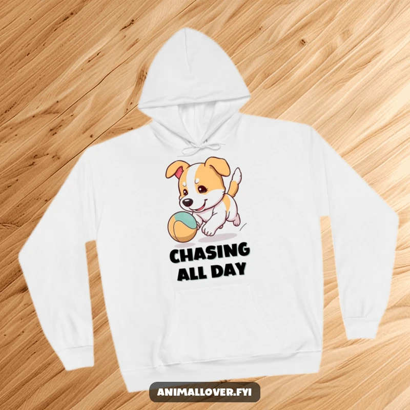 Funny dog hoodie featuring a cartoon dog character intensely focused on chasing a bouncing ball, designed for comfort and humor.