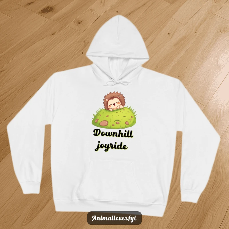 Funny hoodie featuring a happy hedgehog rolling down a grassy hill with eyes closed, perfect for warm, blissful comfort.