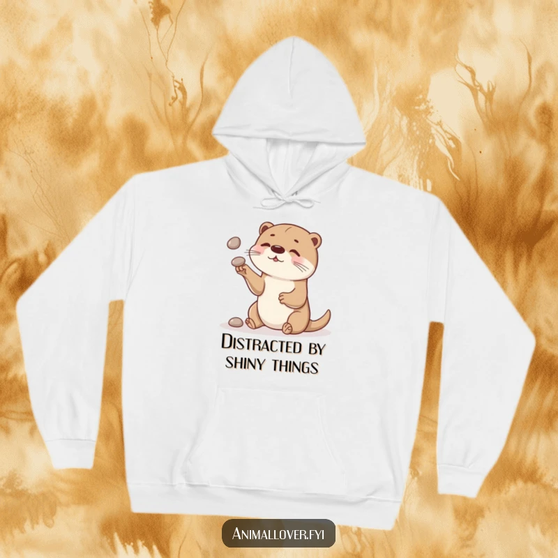 Funny otter hoodie featuring a curious otter playfully juggling smooth stones, perfect for cozy and fun days.