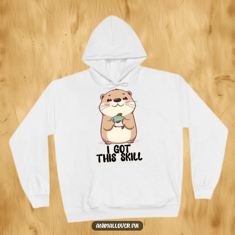 Funny Happy Otter Hoodie featuring a joyous otter balancing a fish on its nose, offering warmth and playful aquatic vibes.