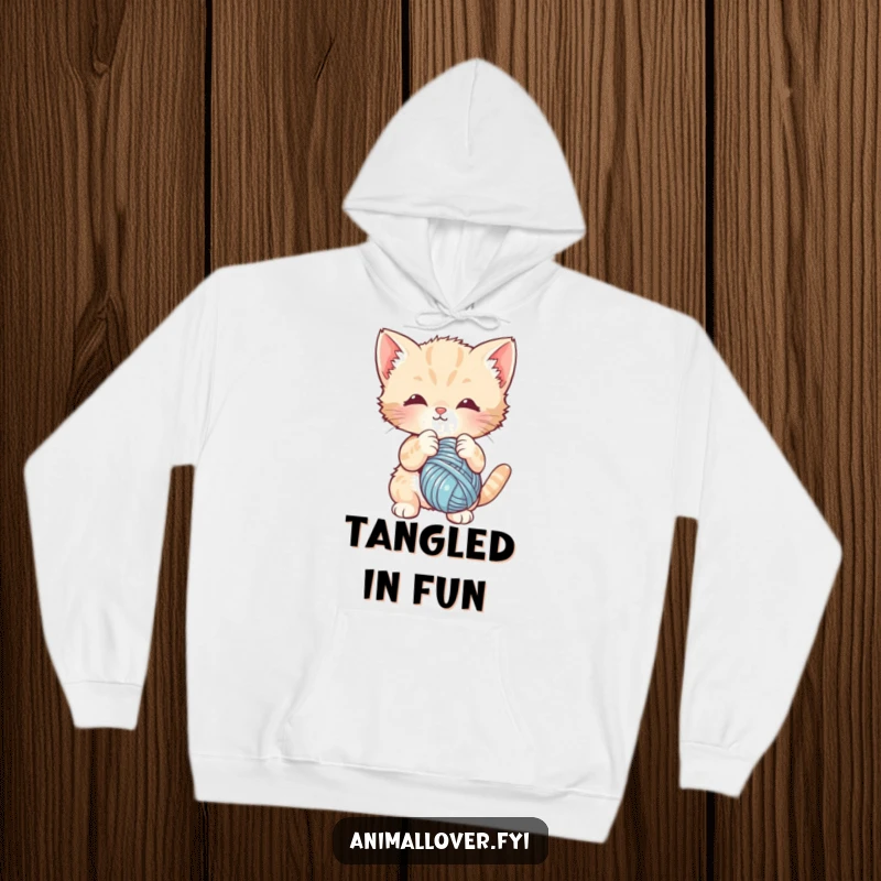 Funny hoodie design of a cute kitten intensely batting at a dangling ball of yarn. Cozy apparel for cat lovers.