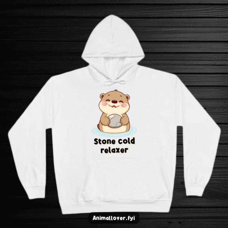 Funny Hoodie featuring a happy otter floating on its back, holding a smooth stone, radiating peaceful and whimsical charm.