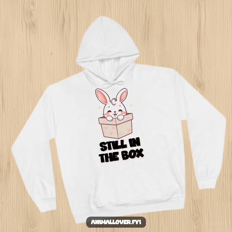 Funny rabbit peeking from a gift box, designed on a warm and cozy hoodie, perfect for a funny gift.