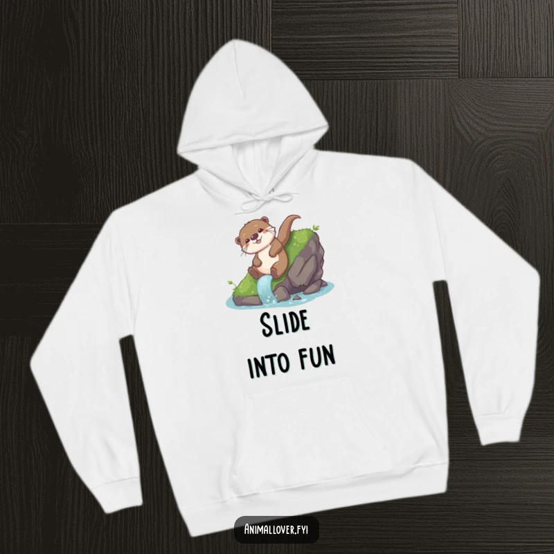 Funny otter hoodie showing a playful otter sliding down a mossy rock with immense glee, radiating pure joy and fun.