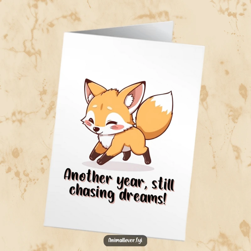 Funny Free Printable Birthday Card: A mischievous fox cub joyfully chases its own tail in a dizzying birthday spin.