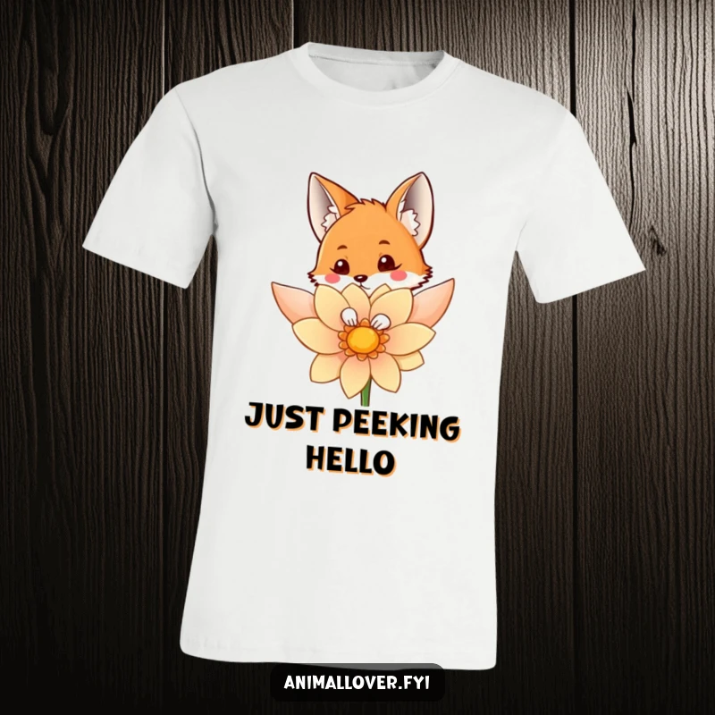 Funny t-shirt featuring a curious fox peeking out from behind a large, vibrant flower, embodying playful discovery.