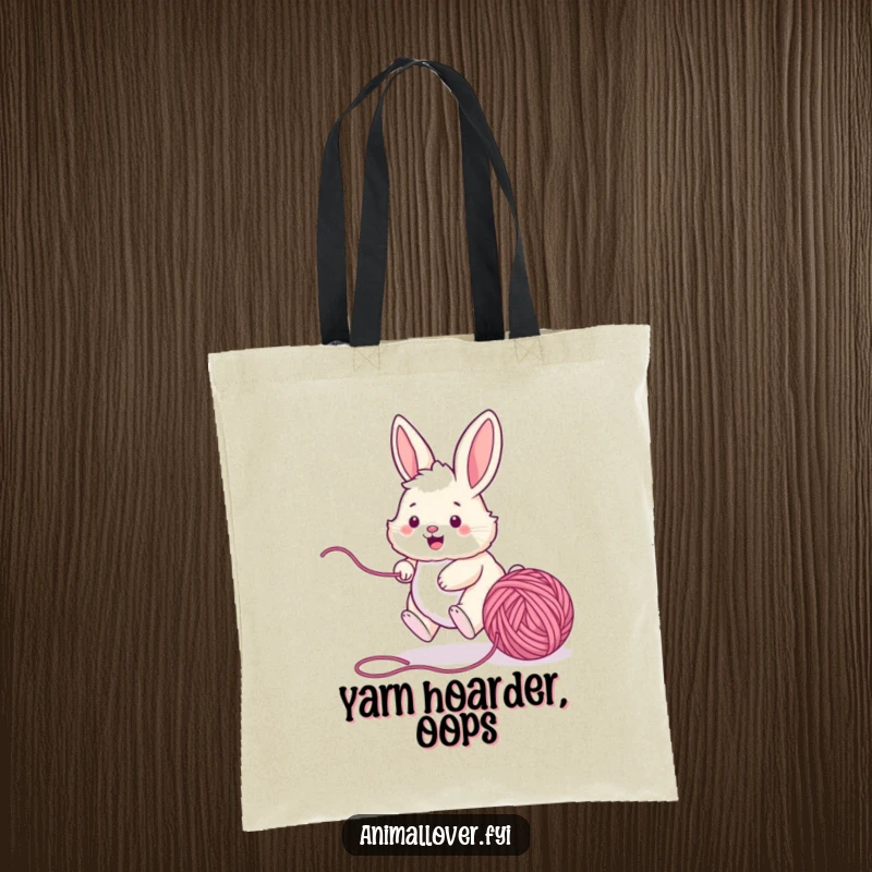 Funny bunny tote bag depicting a lively rabbit chasing a ball of yarn, practical for shopping and showcasing playful animal antics.