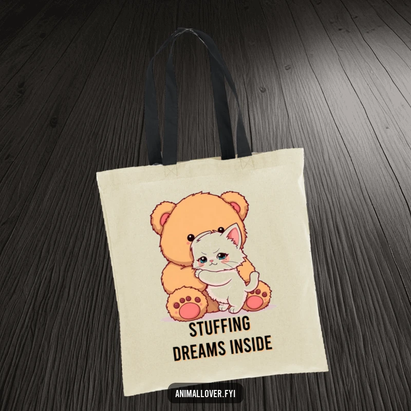 Funny Kitten Tote Bag: A durable bag featuring a determined kitten trying to achieve a massive hug from a giant teddy bear.